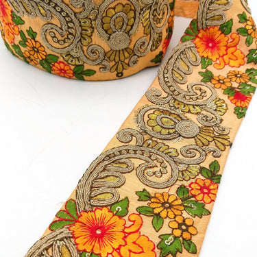 Peach Art Silk Fabric Trim With Orange, Green, Red And Gold Floral Embroidery
